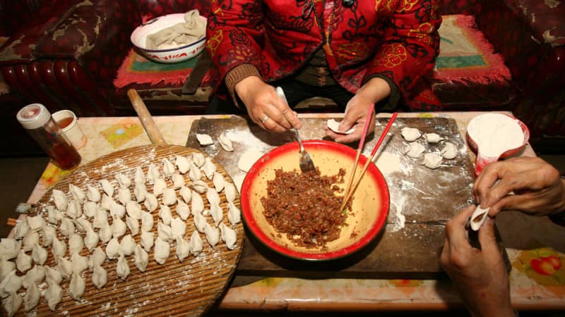 Food is an important part of the celebrations. Here, dumplings are prepared Lunar New Year. 