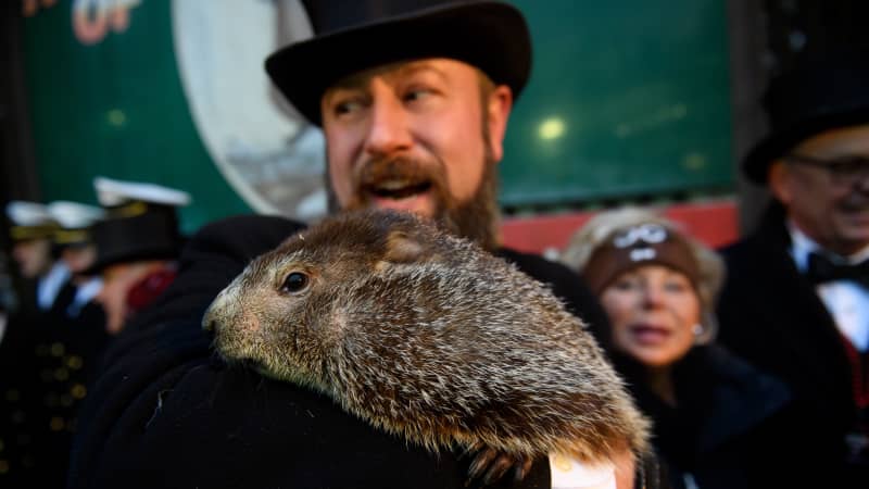 A.J. Dereume holds Punxsutawney Phil after he did not see his shadow on Groundhog Day.
