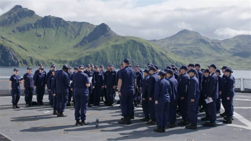 Crew on deck of the USCG Healy, stationed at Unalaska in the Aleutian Islands, Alaska. The Healy is the only US icebreaker currently operating in the northern hemisphere.