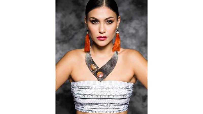 Customers around the world are buying clothing that reflects traditional Inuit markings, such as this top by Martha Kyak, an Inuit historian and fashion designer with Inuk Chic.  