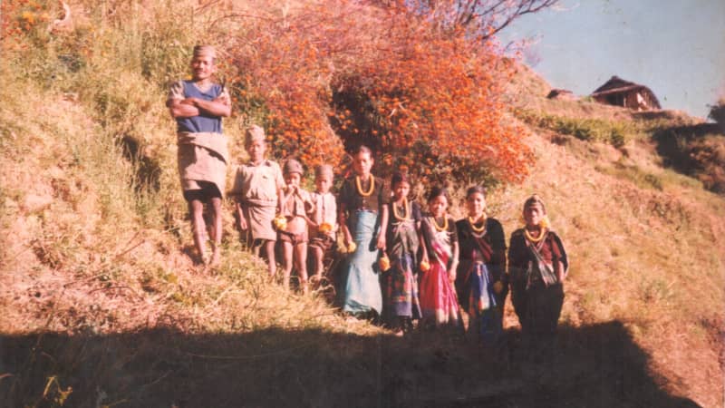 Magar (second left) with his family as a child in Nepal. As a boy he lived in Mirul, Ropla district, later joining the British military aged 19.