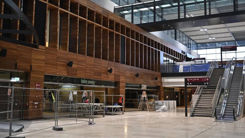 Work was ongoing during a press preview on November 25 at the long-awaited Berlin Brandenburg airport.