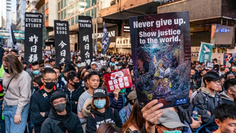 Pro-democracy protesters march on December 8 in Hong Kong.