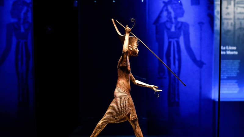 A statuette of Tutankhamun is displayed during the exhibition's visit to Paris.