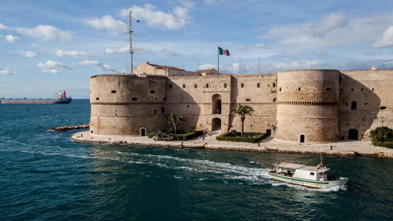 The coastal city of Taranto, Italy, home to the impressive Castello Aragonese, pictures, is offering up homes for a little over $1