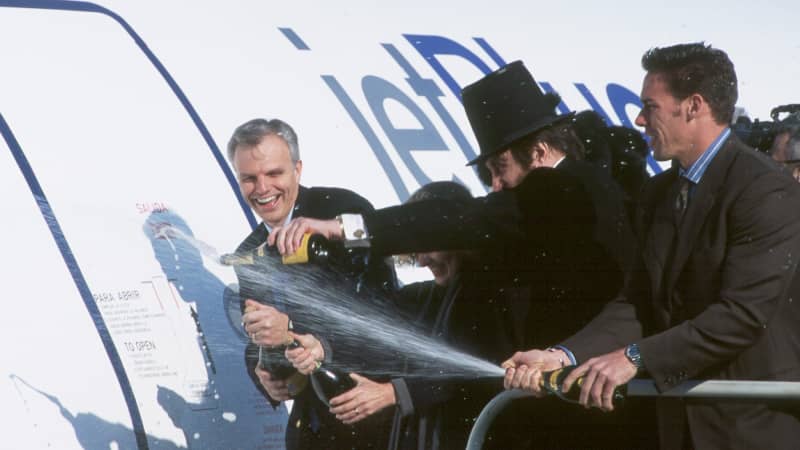 David Neeleman, founder and CEO of JetBlue, gives a Champagne christening in 2000 to Bluebird, an A320 which was the airline's first aircraft. 