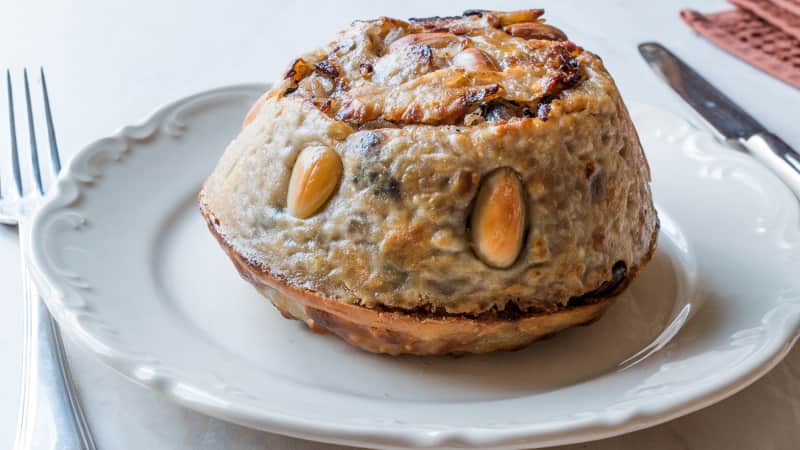 Perde pilav -- a buttery dough  filled with rice, chicken, currants, almonds, pine nuts and butter.