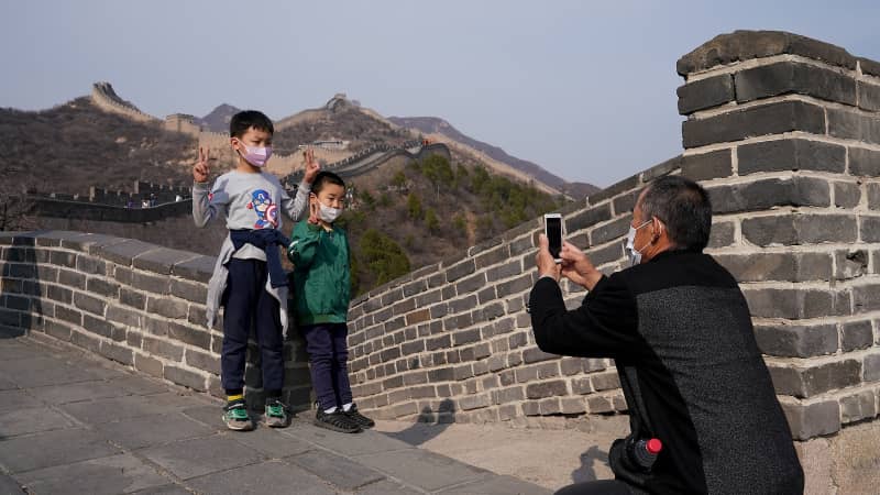 Children wear protective masks as they visit the Badaling section of China's Great Wall on March 24.  