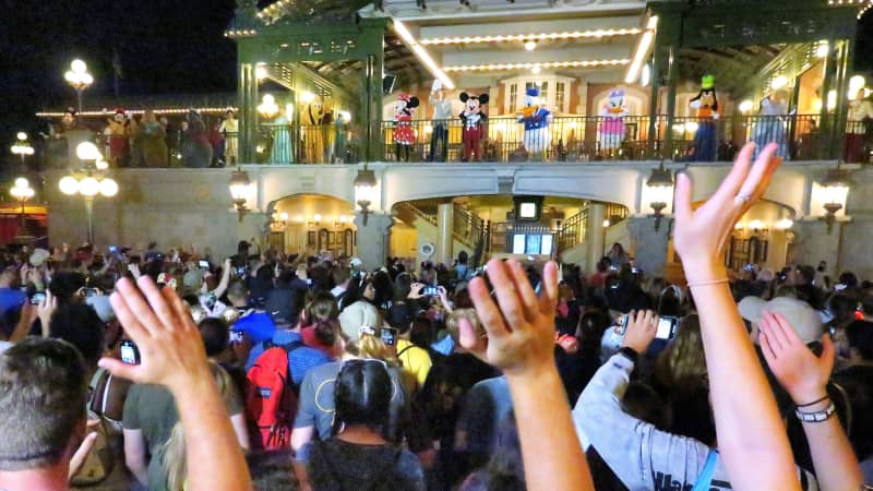 Guests wave goodbye to Mickey Mouse and friends on Main Street USA in the final minutes before the park closed March 15.