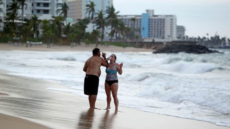 Tourists on the beach in Old San Juan, Puerto Rico, before the coronavirus pandemic.