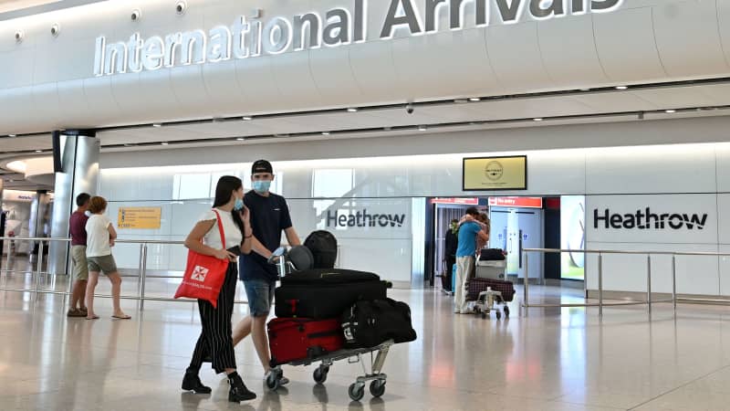 Travelers at the arrivals hall at Terminal Two of London Heathrow Airport on May 9, 2020