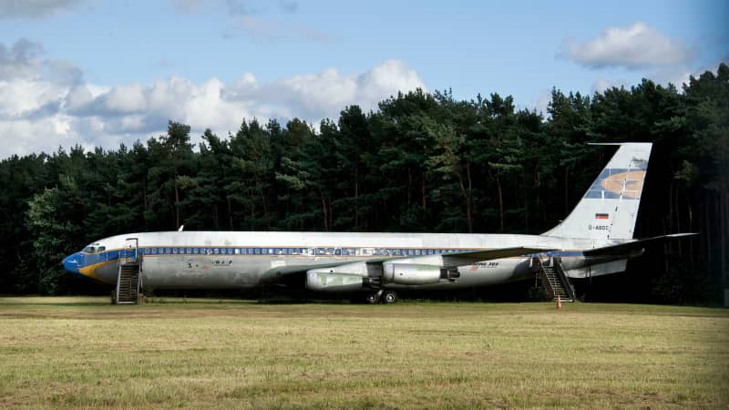 An old Boeing 707 that was presented as a gift to Lufthansa sits at the end of the runway.