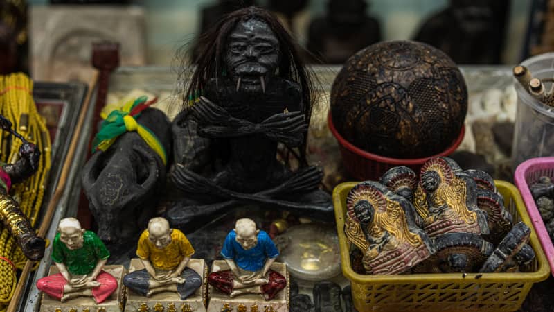 Shrunken heads on display at the Tha Prachan amulet market.