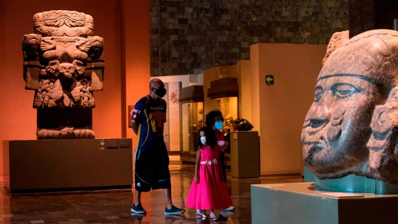 People visit the National Museum of Anthropology in Mexico City on November 14, 2020.