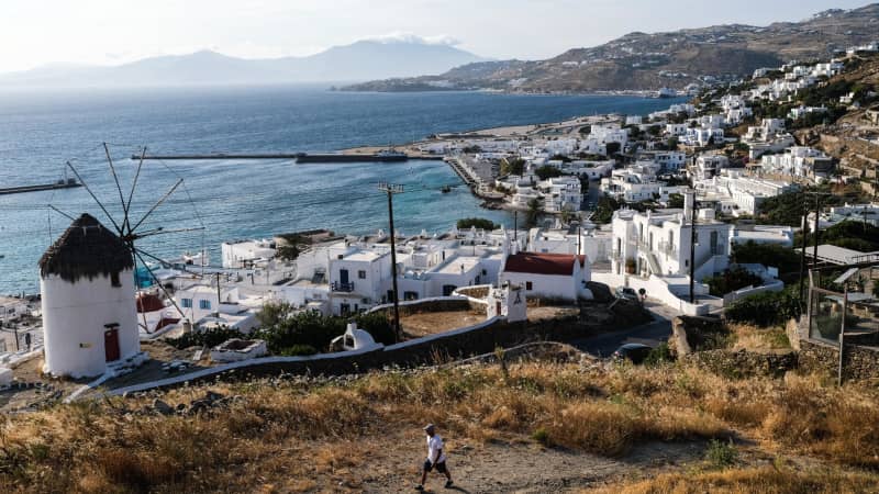  A view of Bonis Windmill and the Old Port of Mykonos, Greece. This popular vacation nation remains at the CDC's Level 4.