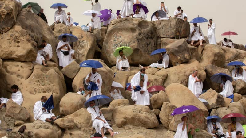 Muslim pilgrims gather to pray on Saudi Arabia's Mountain of Mercy in July 2021. 