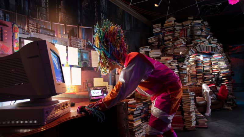 A Meow Wolf character explores the past in the Library, part of Denver's Convergence Station.