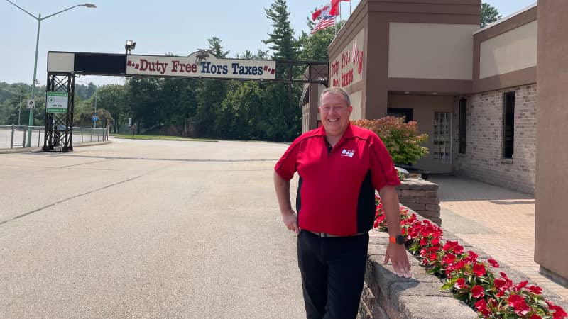 Jeff Butler stands outside his duty-free store just inside the Canadian border. He said he's not expecting a big influx of business at first.