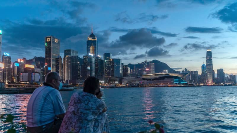 A couple takes in the Hong Kong sunset on July 30, 2020.   