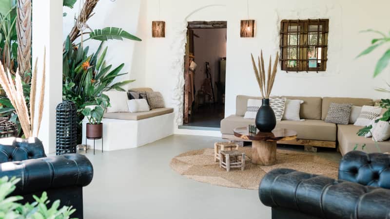 The casitas and villas at Can Sastre are cocooned by lush foliage, olive and orange trees.