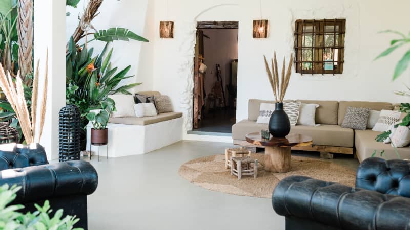 The casitas and villas at Can Sastre are cocooned by lush foliage, olive and orange trees.