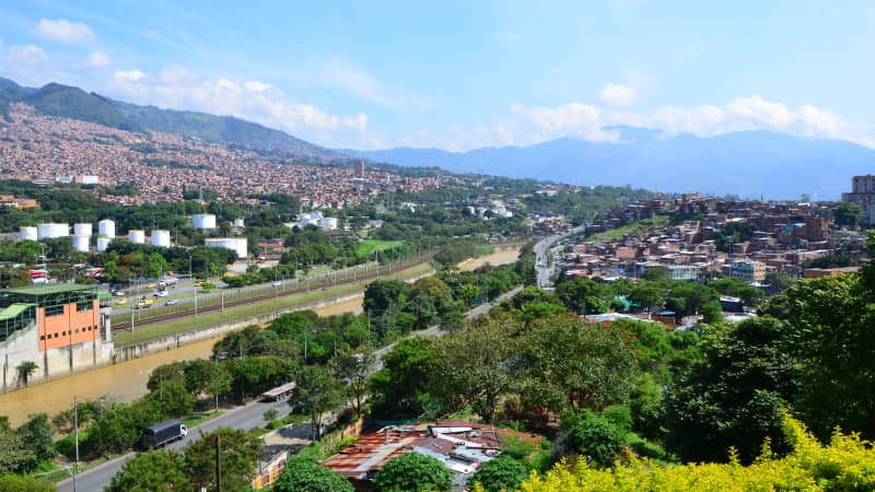 A view from the top of El Morro looks across Rio Medellín and the tram station.