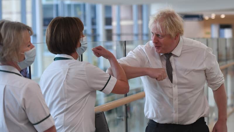 Boris Johnson was photographed visiting a hospital without a mask in November.
