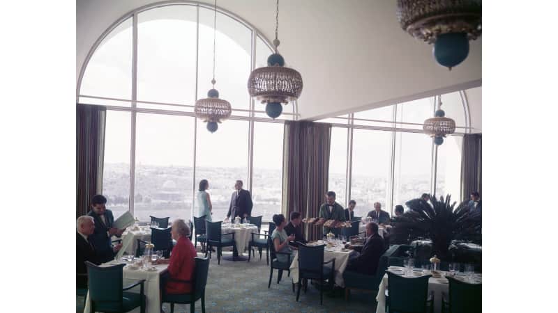 When needed, Wilma deZanger would step into her husband's photos as a model. She's the woman in blue in the background in this photo at this photo of the Hotel Jerusalem Intercontinental