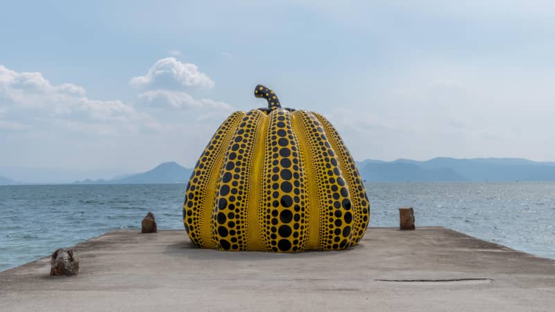 Yayoi Kusama is known for her polka-dotted pumpkin sculptures, like this one on Naoshima.