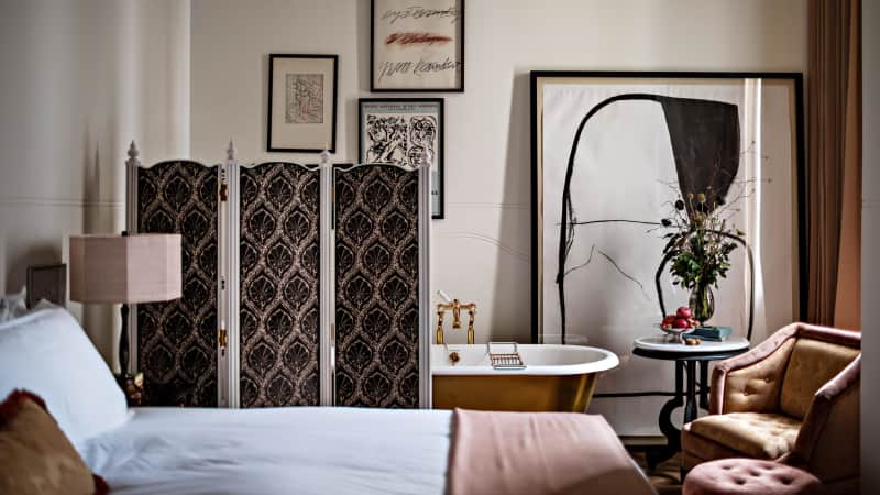 Rooms at NoMad London are cool and eclectic. There's also a signature restaurant on site.