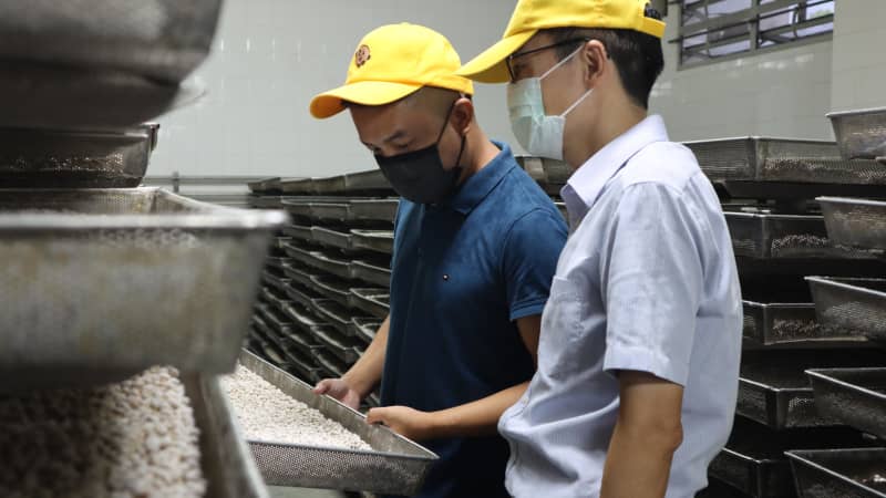 Daniel Chan, left, is the fourth generation co-owner of the Koon Chun Sauce Factory. 
