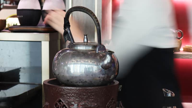 Glassbelly says that boiling water in a silver pot helps ionize it, making the tea silkier.
