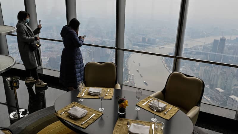 Guests take in the panoramic views from the Heavenly Jin restaurant. 