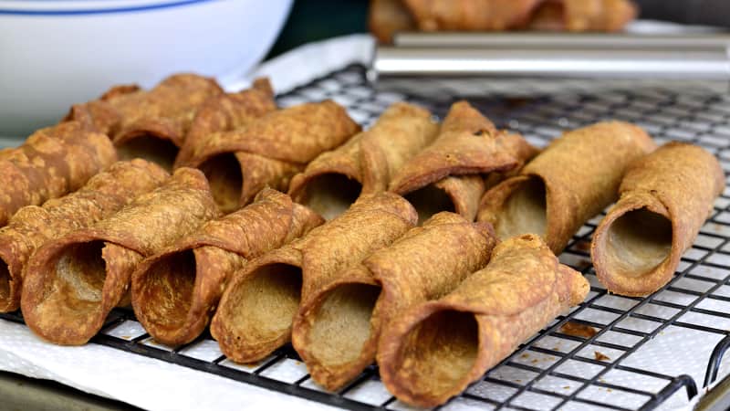 Cannolo, a tube-shaped shell of fried pastry dough filled with fresh ricotta, is one of Sicily's most famous pastries