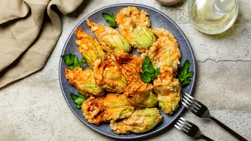 These zucchini flowers are stuffed with ricotta cheese and parsley. 