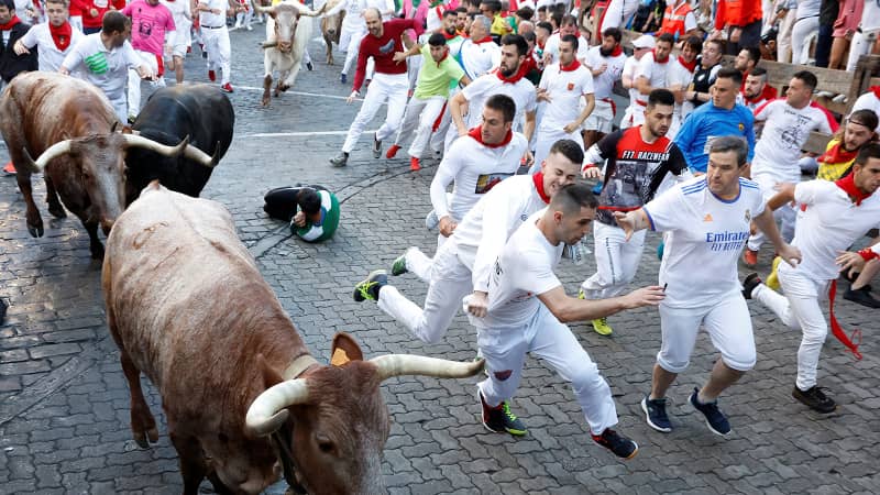 Revelers race during the running of the bulls at the San Fermin festival in Pamplona on July 7.
