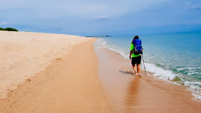 On certain sections of the path, hikers can soothe their weary feet in the warm waters of the Mediterranean.