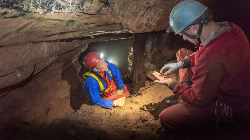 National Trust archaeologist Jamie Lund (left) and Derbyshire Caving Club member Ed Coghlan (right) explore the disused cobalt mine in the English village of Alderley Edge. 