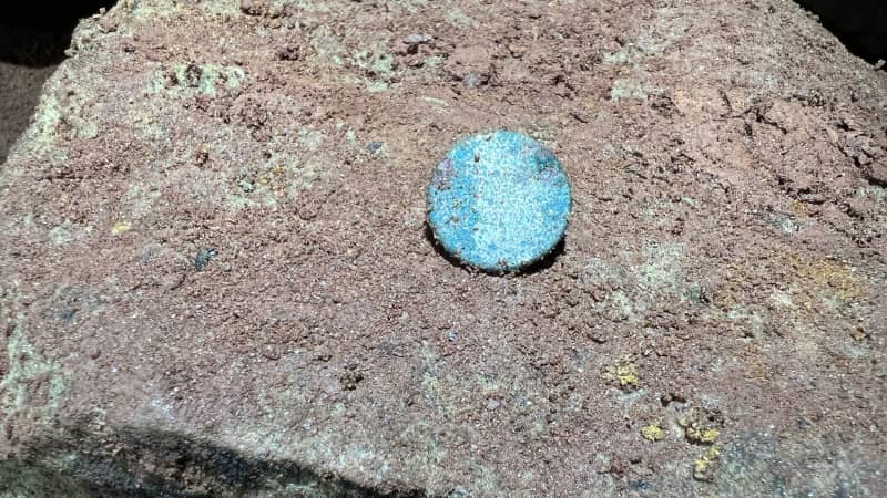 Researchers photographed and catalogued items such as this small blue button belonging to a former quarry worker.