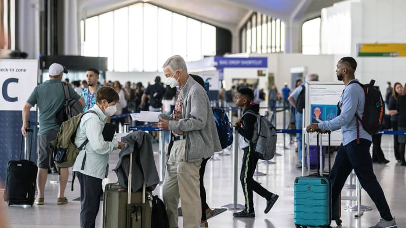 Travelers line up to check in at Newark Liberty International Airport on July 1. Newark is the world's No. 2 airport for cancellations this summer.
