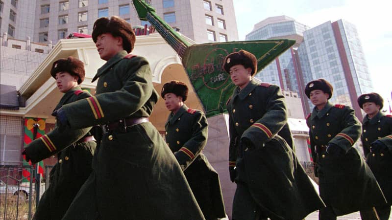 Chinese soldiers marching past the Hard Rock Beijing in the 1990s.