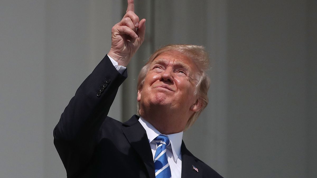 Image result for trump looking at eclipse