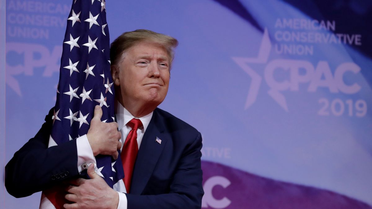 Image result for trump hugging flag