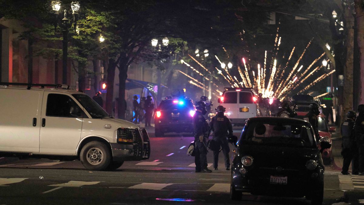 Portland riots: Officers injured after protesters launch fireworks ...