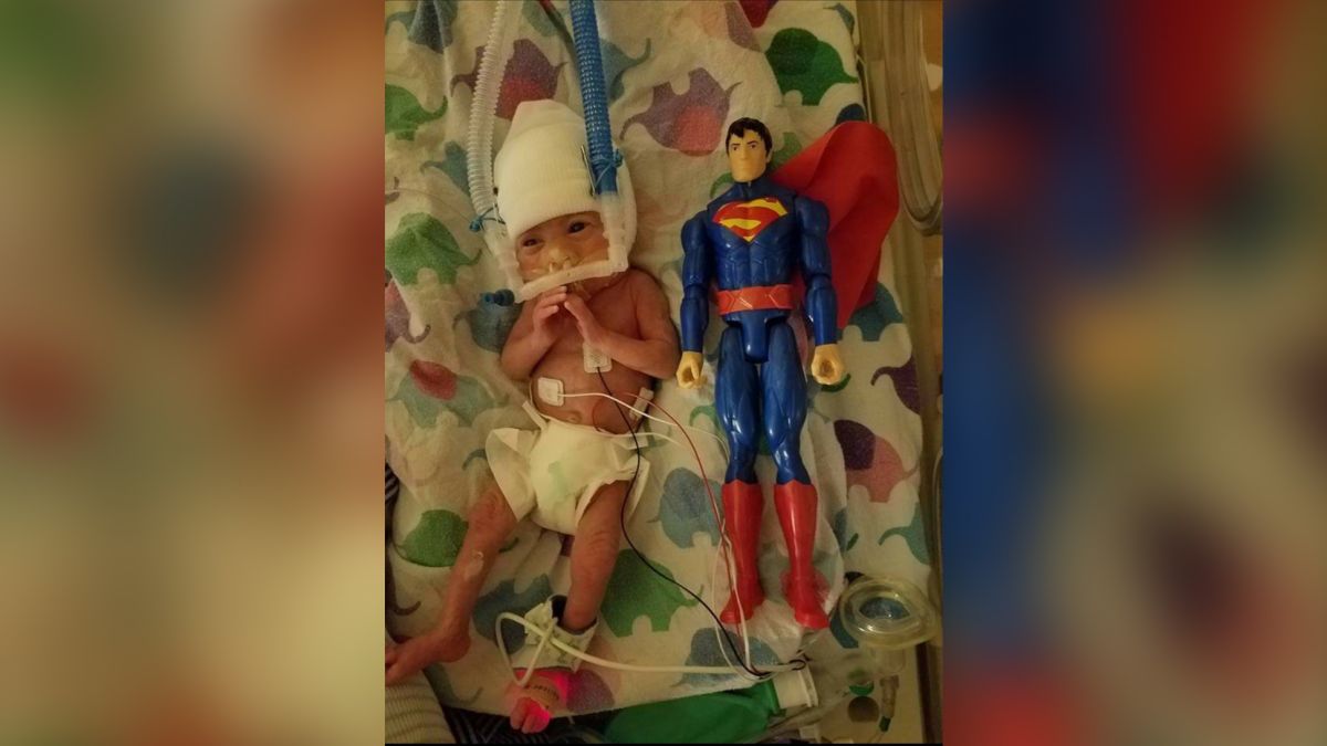 Preemie Baby Born The Size Of Superman Doll Parents Take Photos With The Doll Every Year To Chart Son S Growth Cnn