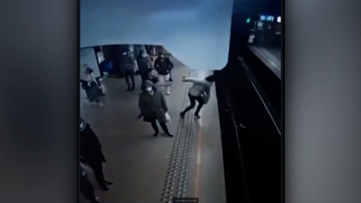 Woman survives push from platform as train driver stops with inches to  spare | CNN