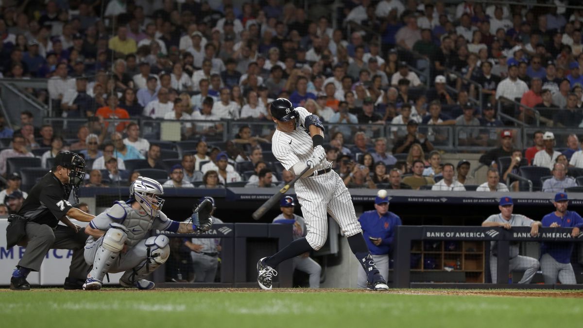 Dyersville, United States. 12th Aug, 2021. New York Yankees' Aaron Judge  (99) celebrates with Rougned Odor (12) after a three-run homer against the  Chicago White Sox during the third inning of the