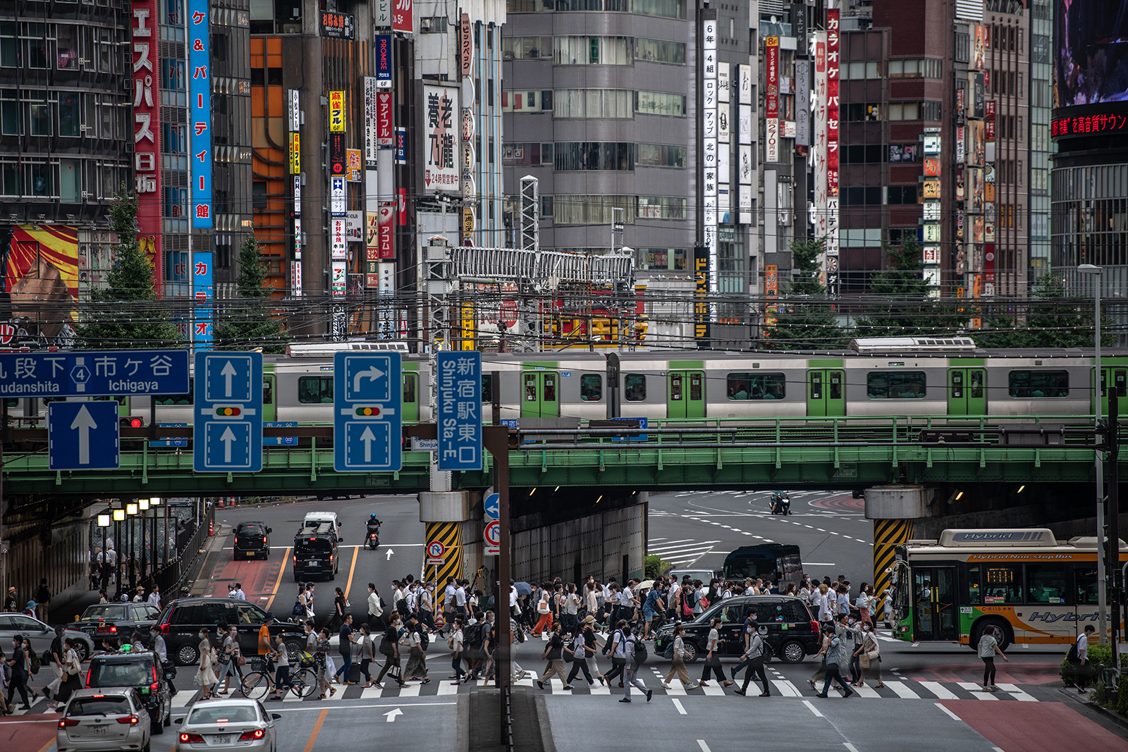 People cross a road in Tokyo, on August 17.