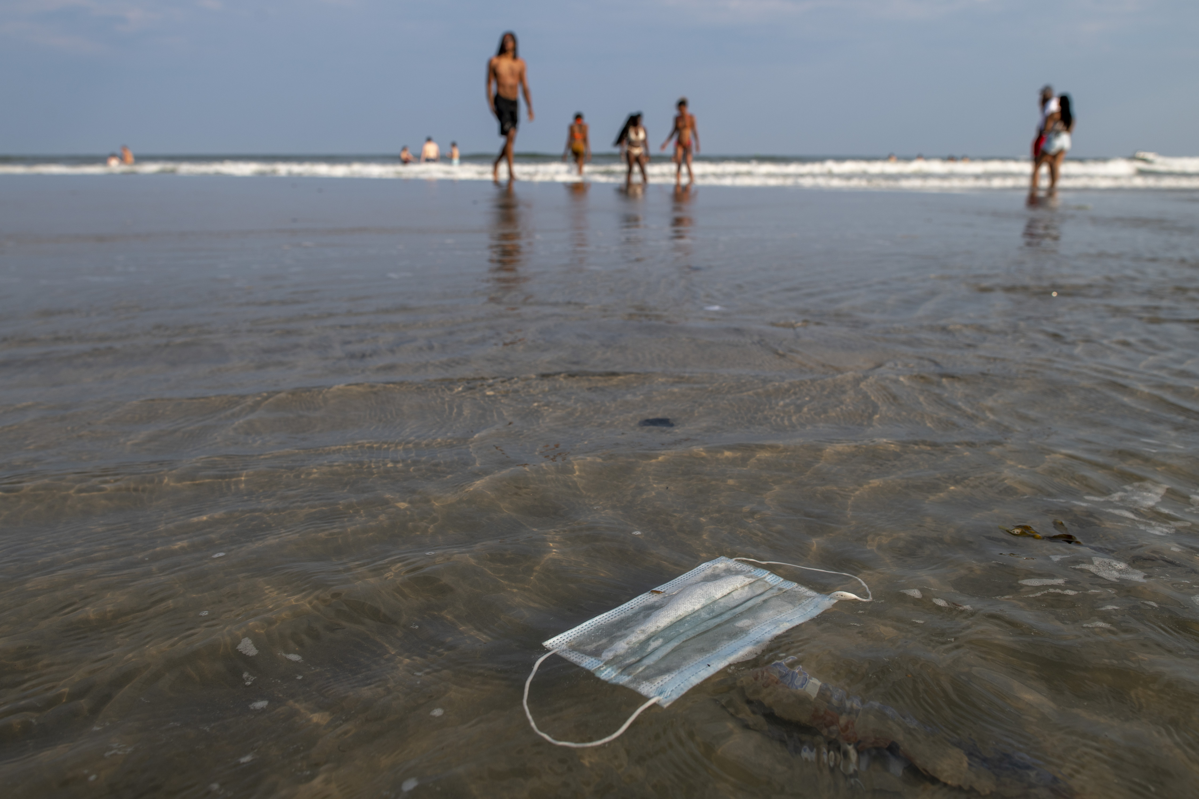 A discarded mask floats in the ocean on July 3 in Wildwood, New Jersey. 