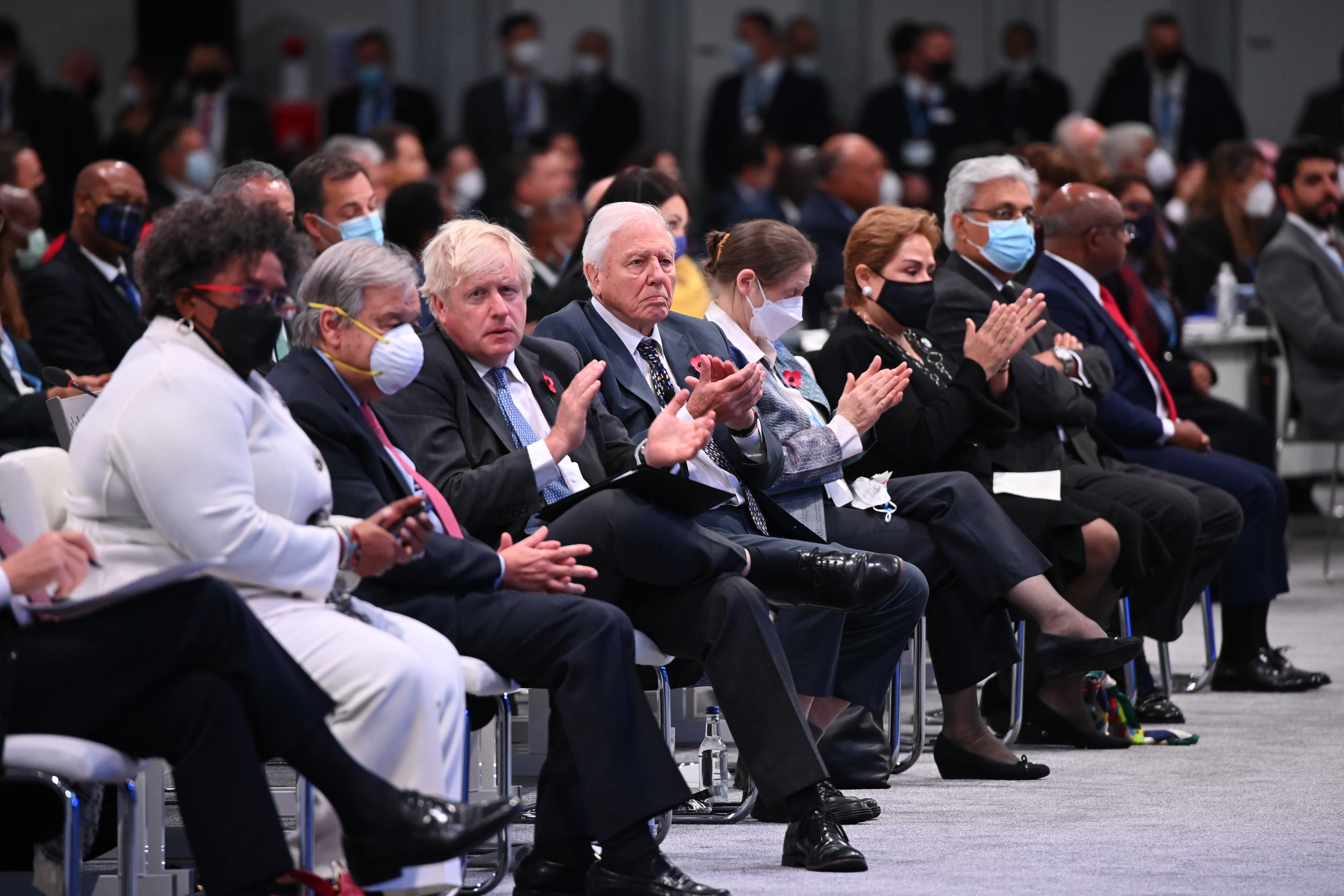 Secretary-General of the United Nations António Guterres, second from left, British Prime Minister Boris Johnson, third from left, and Sir David Attenborough, fourth from left, are seated in the front row during the opening ceremony of the conference Monday. 